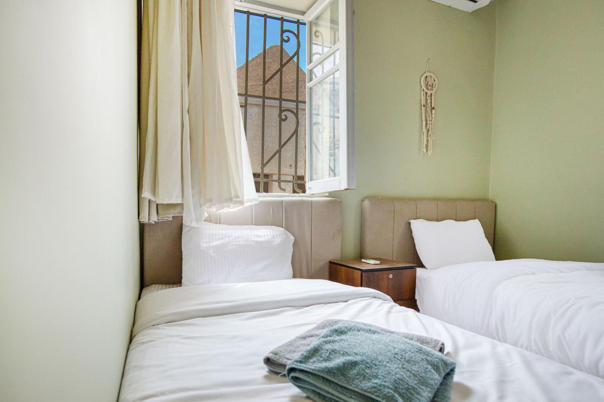 The Grand Pyramids View Hotel Kafret el-Gabal Habitación foto